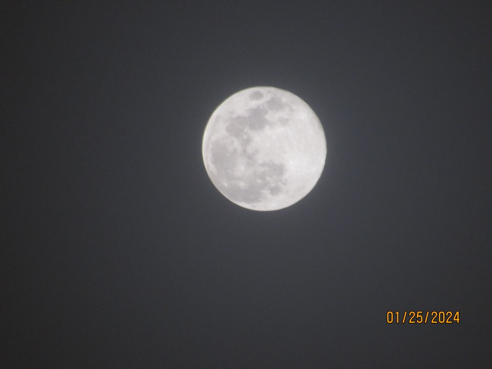 a picture of the moon glowing.