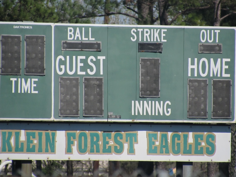 a picture of the highschools scoreboard outside.